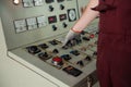 The worker`s hand in a dirty glove in production.