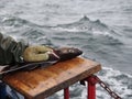 Worker's hands cutting fish