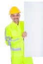 Worker in safety jacket presenting empty board Royalty Free Stock Photo