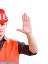 Worker in safety vest hard hat showing stop hand Royalty Free Stock Photo