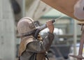 Worker, sandblasting the corrode hull of a sailing vessel