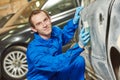 Automobile body sanding with sander. Repair car service Royalty Free Stock Photo