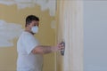 Worker sanding the drywall mud using sand trowel during renovation the house Royalty Free Stock Photo
