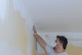 Worker sanding the drywall mud using sand trowel during renovation the house Royalty Free Stock Photo