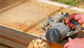 Worker Sawing Wood