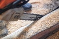 The worker saws off a log with a chainsaw Royalty Free Stock Photo