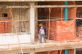 Worker on scaffold in construction site Royalty Free Stock Photo