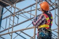 Worker on the scaffolding construction