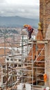 Worker on scaffolding on the New Cathedral