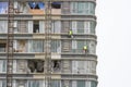 Worker scaffolding on the side of the building