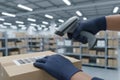 Worker scanning barcode on a box in a warehouse Royalty Free Stock Photo