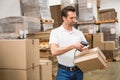 Worker scanning package in warehouse Royalty Free Stock Photo