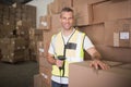 Worker scanning package in warehouse Royalty Free Stock Photo