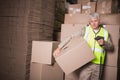 Worker scanning package in warehouse Royalty Free Stock Photo