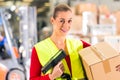 Worker scans package in warehouse of forwarding Royalty Free Stock Photo