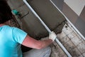 Worker screeding outdoor cement floor with screed Royalty Free Stock Photo