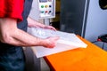 A worker seals the mold for pouring plastic. Manufacturing of plastic products. Medium business concept. Hands close-up
