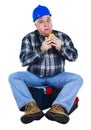 Worker seated on the toolbox