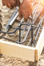 Worker Securing Steel Rebar Framing With Wire Plier Cutter Tool