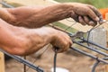 Worker Securing Steel Rebar Framing With Wire Plier Cutter Tool Royalty Free Stock Photo