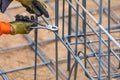 Worker Securing Steel Rebar Framing With Wire Plier Cutter Tool Royalty Free Stock Photo