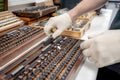 The worker selects gauge blocks to obtain the required control size of the part being manufactured and adjusts the measuring tool Royalty Free Stock Photo