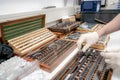 The worker selects gauge blocks to obtain the required control size of the part being manufactured and adjusts the measuring tool Royalty Free Stock Photo