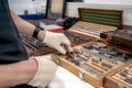 The worker selects gauge blocks to obtain the required control size of the part being manufactured and adjusts the measuring tool Royalty Free Stock Photo