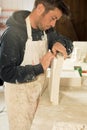 Worker Separating Plaster Model from Mold