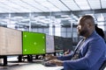 Worker in server hub using green screen computer to find misconfigurations Royalty Free Stock Photo