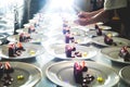 Worker serving desserts in restaurant