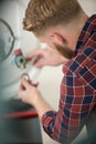 worker set up central gas heating boiler at home Royalty Free Stock Photo