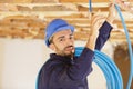 worker sets ceiling profile in new flat Royalty Free Stock Photo