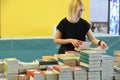 Worker setting up the booth the day before the opening of the international book fair Turin Italy