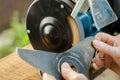 Worker sharpening his blade lawn mower. Royalty Free Stock Photo