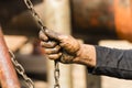 Worker at a shipyard in Dhaka Bangladesh holds a chain