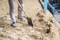 Worker with a shovel working excavator in construction building site Royalty Free Stock Photo