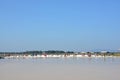 Worker shoveling salt at salt pan at Thailand