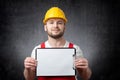 Worker showing blank clipboard Royalty Free Stock Photo