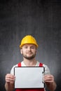 Worker showing a blank clipboard Royalty Free Stock Photo