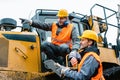 Worker with heavy excavation machinery in mining operation Royalty Free Stock Photo