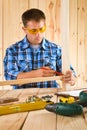 Worker sketh on the plank