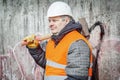 Worker with sledge hammer near the wall Royalty Free Stock Photo