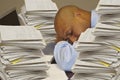 Worker Sleeping While Surrounded With Stacks of Paper Work Royalty Free Stock Photo