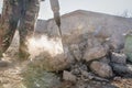 Worker smashes concrete with a jackhammer Royalty Free Stock Photo