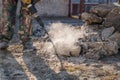 Worker smashes concrete with a jackhammer Royalty Free Stock Photo