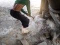 Worker smashing with sledge hammer on the floor. Royalty Free Stock Photo