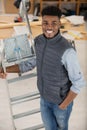 worker smiling holding ladder Royalty Free Stock Photo