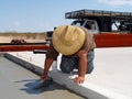 Worker Smoothing out a Concrete Slab Royalty Free Stock Photo