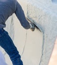 Worker Smoothing Wet Pool Plaster With Trowel